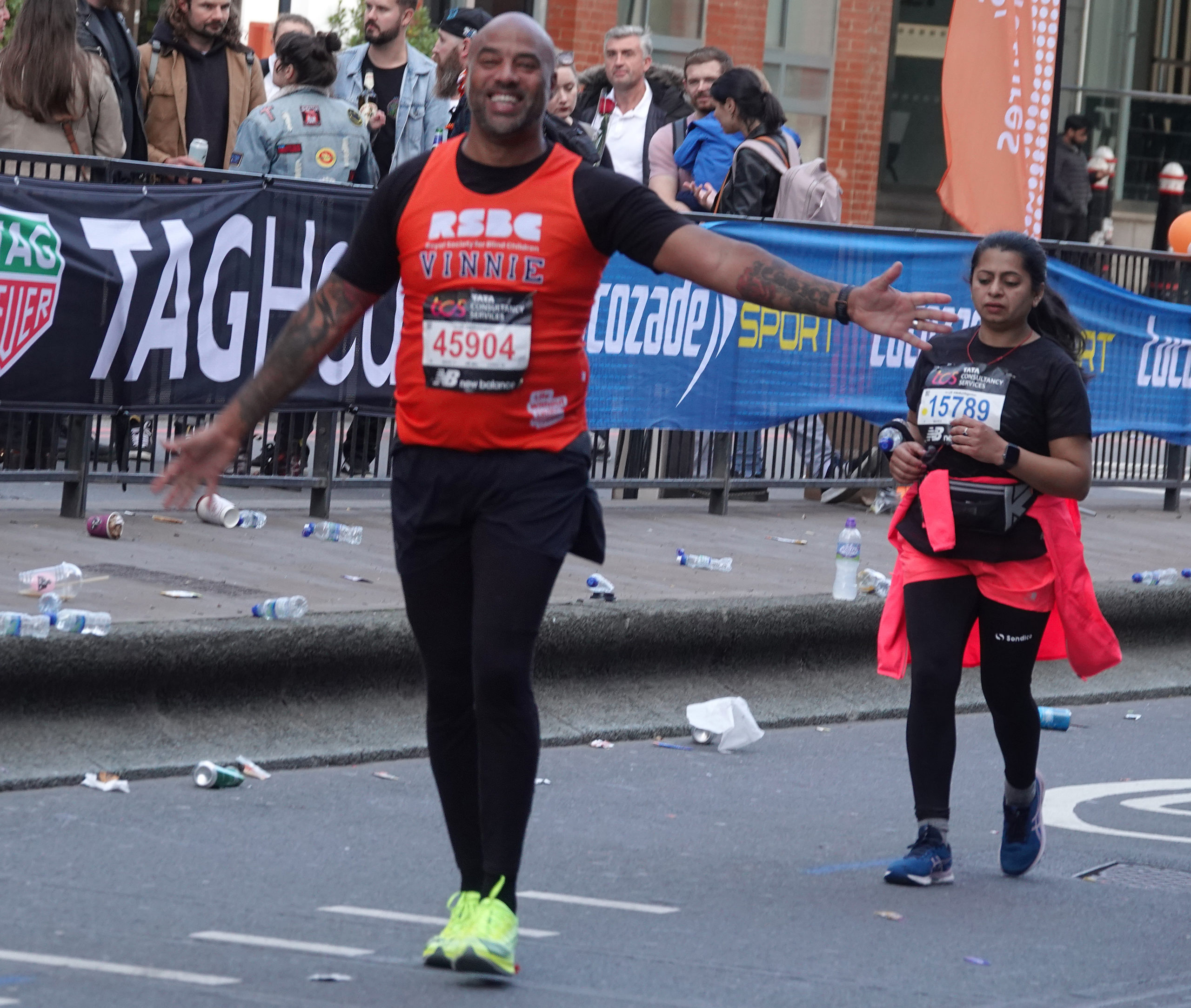 A man opening his arms looking happy walking