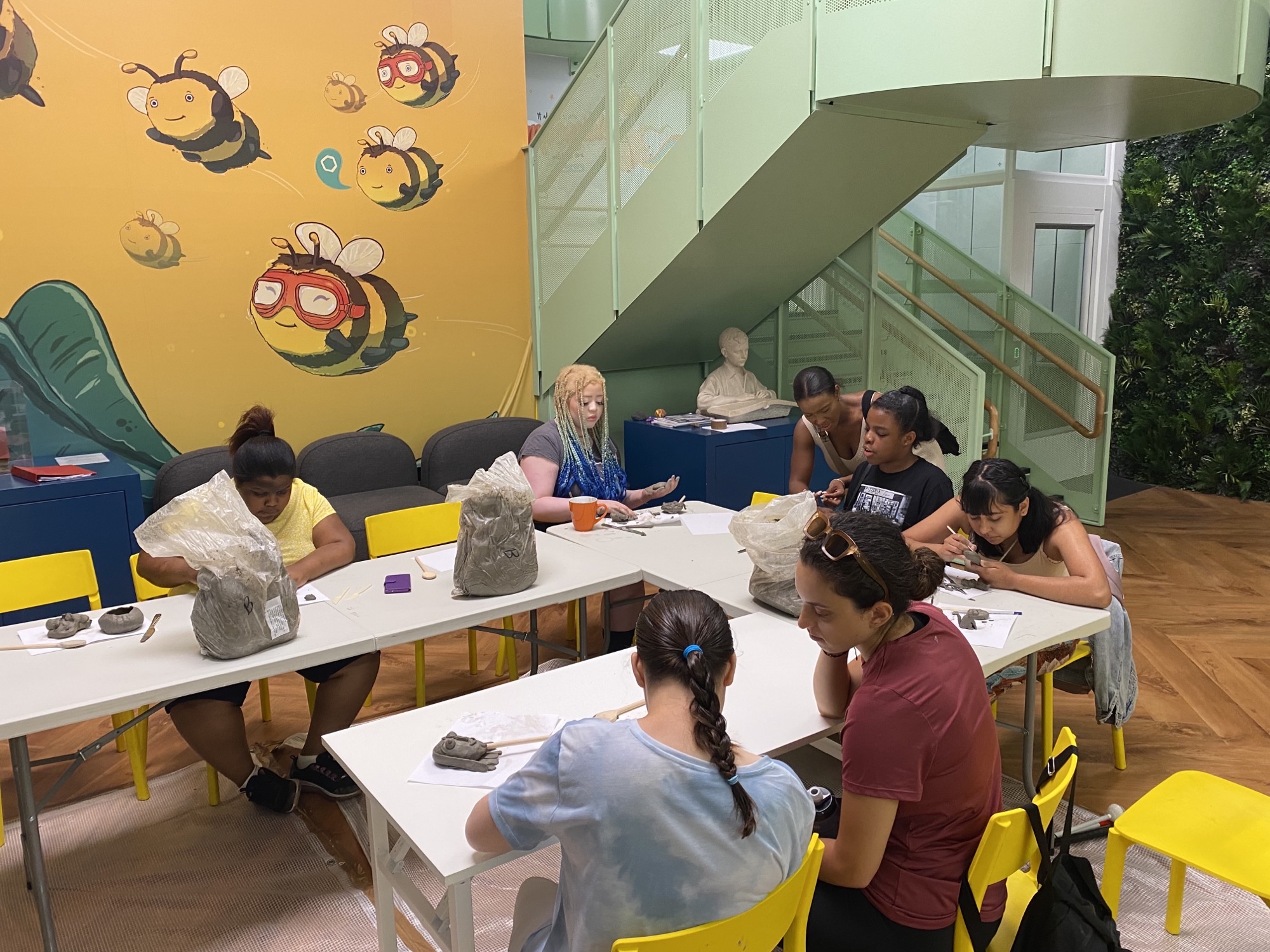 A group of young people making sculpture