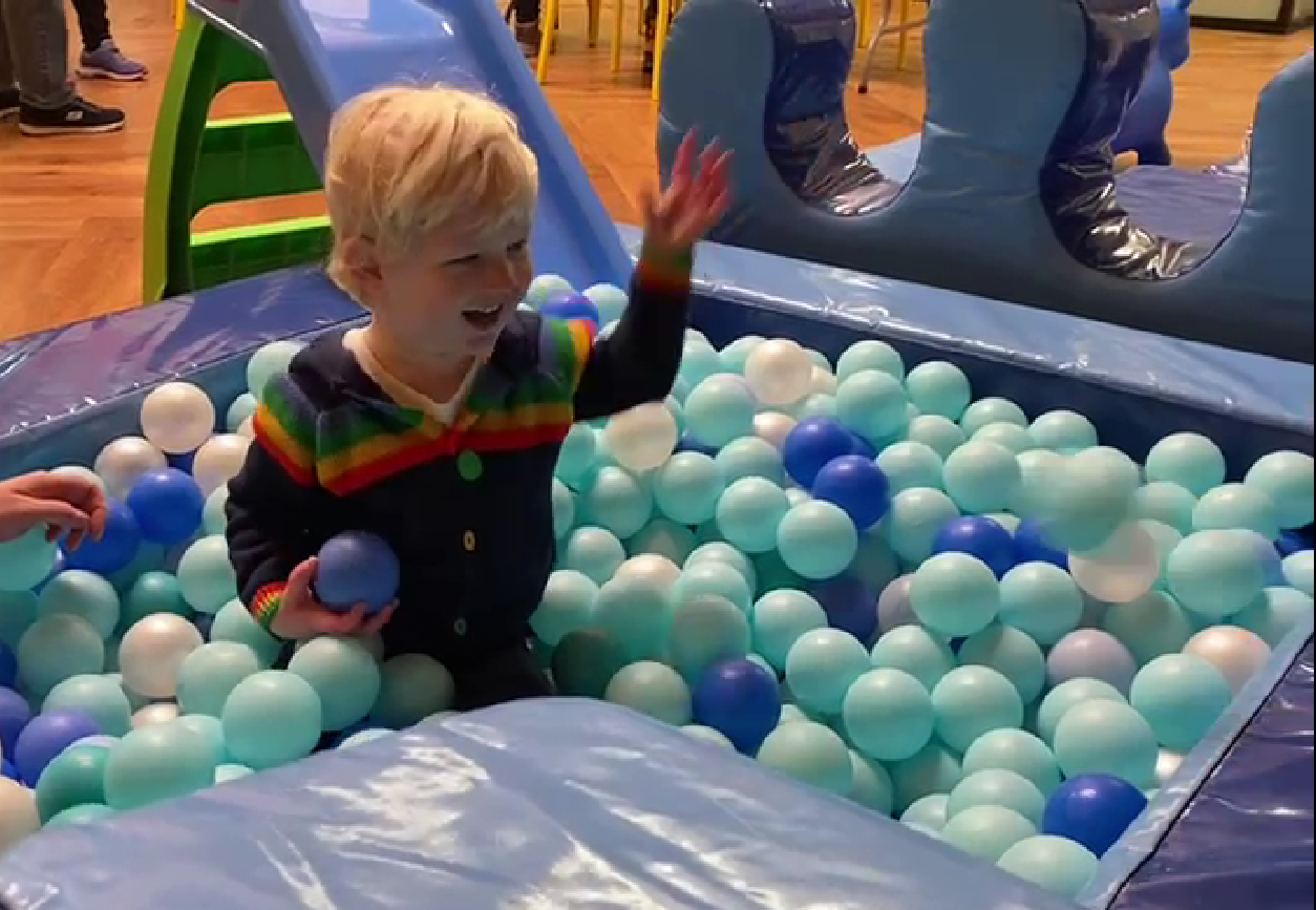 A child playimh in a ball pit in the LWLC