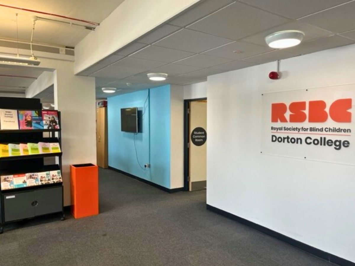 Dorton College reception area with a big sign on the wall showing the RSBC Dorton College logo