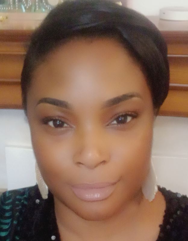 Headshot of Joyce, an Occupational Therapist at RSBC Dorton College. Joyce is a dark-skinned woman with dark-brown hair pulled back into a ponytail. She is wearing an black shirt and silver earrings. She is looking straight at the camera and smiling softly.