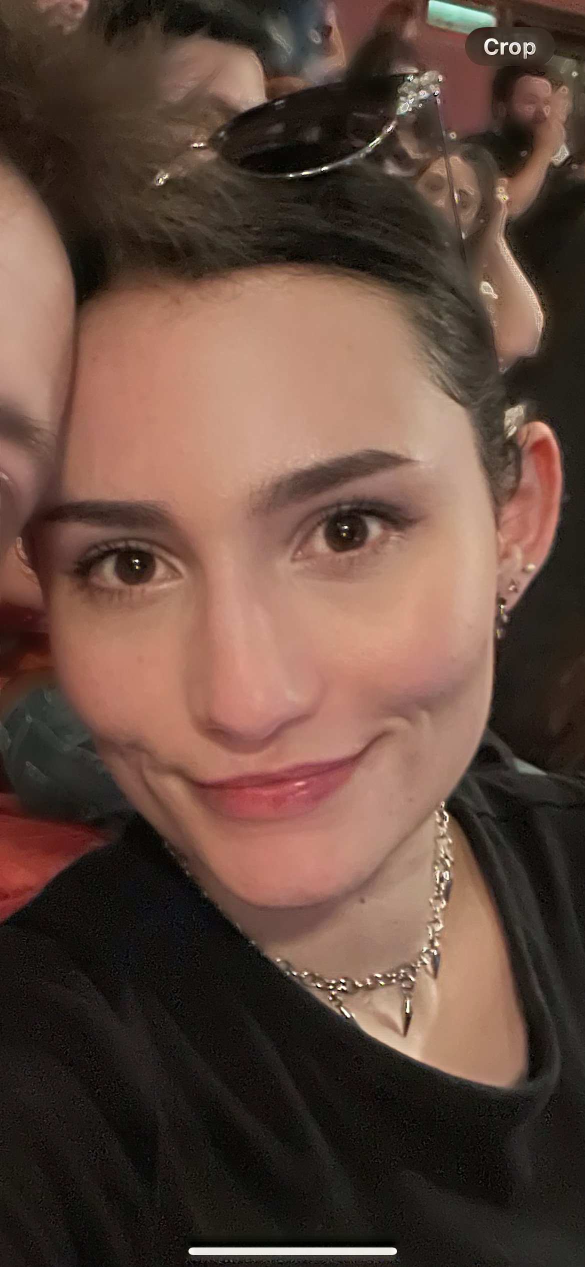 Headshot of Elise, one of the Marketing Executive & Business Partners at RSBC. Elise is a light-skinned woman with dark brown medium-length hair. She is wearing a black t-shirt, a silver chain necklace and is looking straight at the camera. She is smiling.